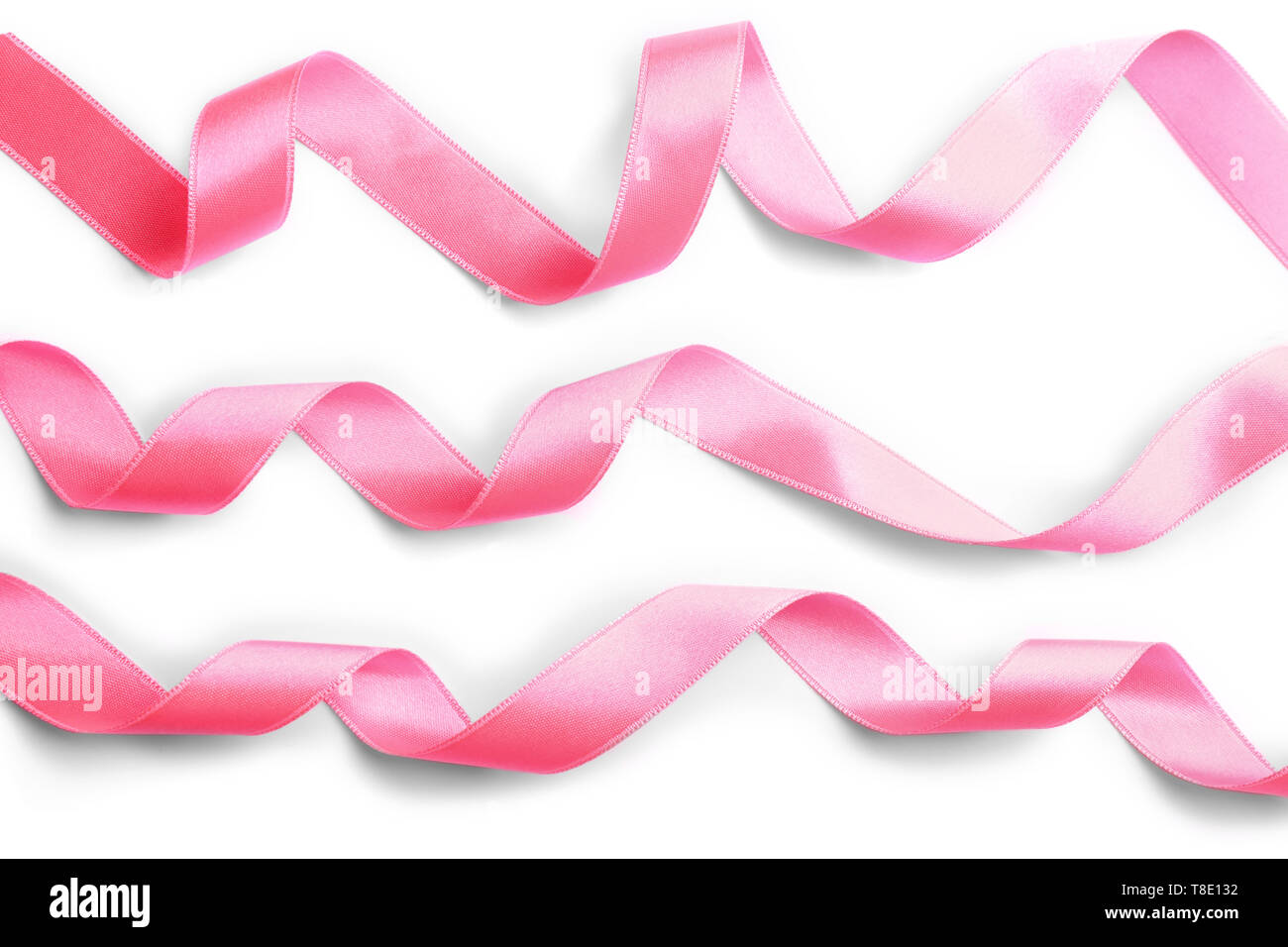 Pink satin ribbons on white background Stock Photo - Alamy