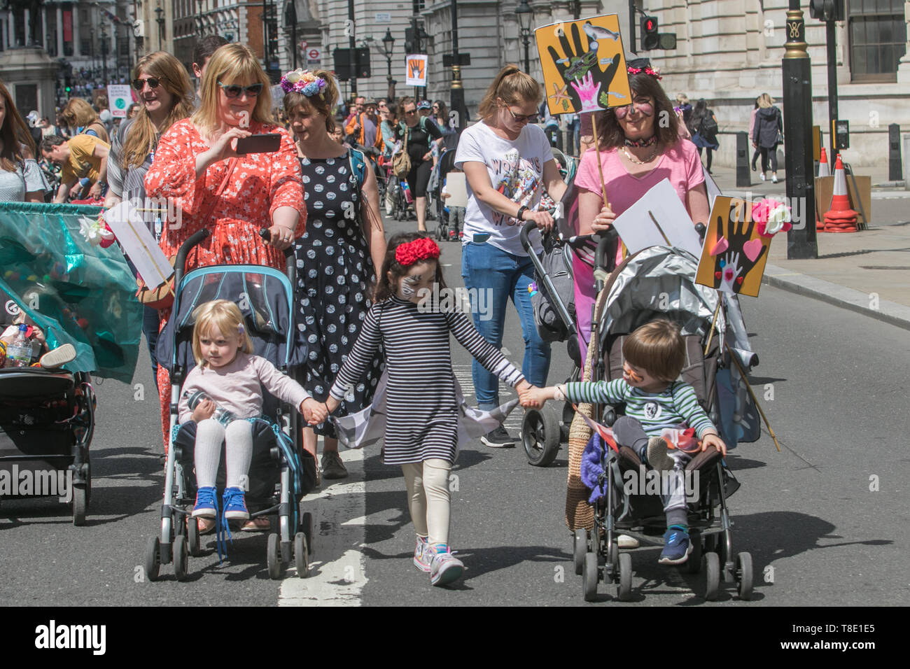 London, UK. 12th May, 2019. Thousands of parents, accompanied with children  and their families marched  in central London to demand urgent action to tackle climate change after British health secretary Matt Hancock named “dirty air” as the “largest environmental risk to public health in the UK” and warned of a growing national health emergency triggered by the “slow and deadly poison” of air pollution. Credit: amer ghazzal/Alamy Live News Stock Photo