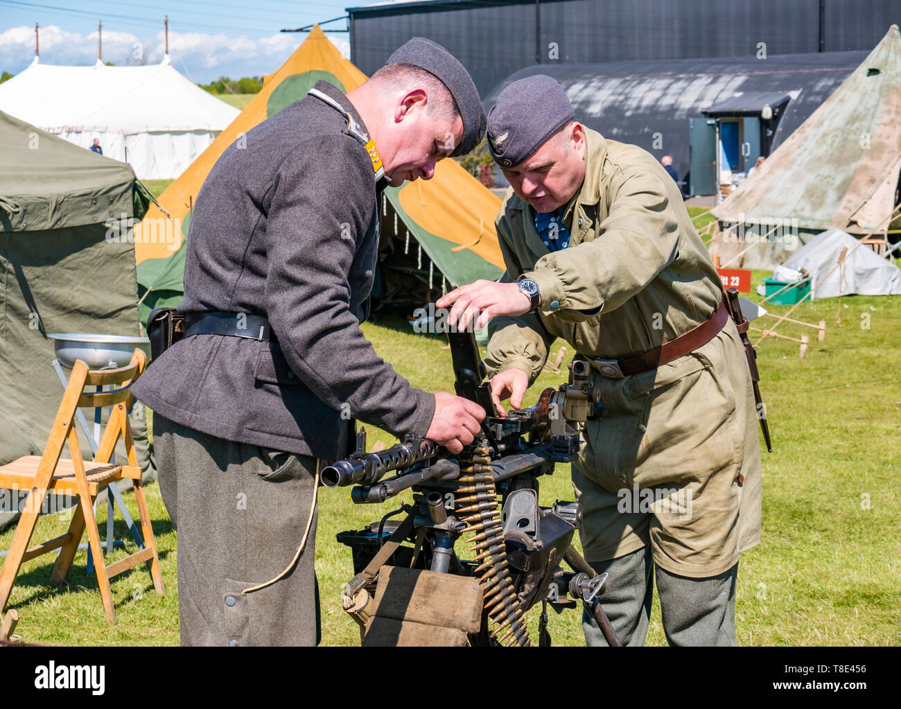 Museum of Flight, East Fortune, East Lothian, Scotland, UK 12th May, 2019. Wartime Experience: A family day out with all things related to the World Wars including a replica of a second world war German army  camp and military equipment,. Men dressed in German military uniform with a machine gun Stock Photo