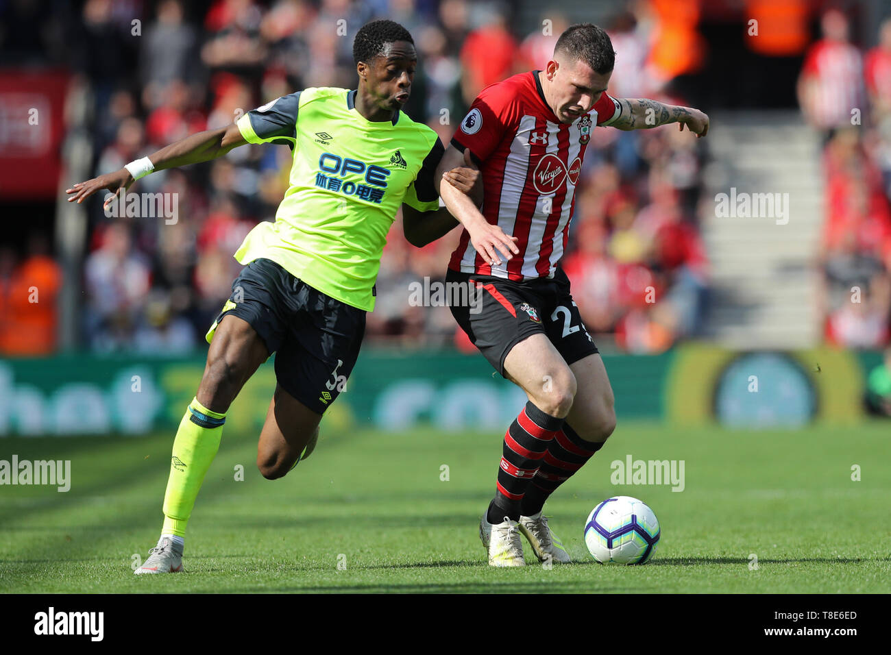 Southampton, UK. 12th May, 2019. Huddersfield Town defender Terence Kongolo  puts pressure on Southampton midfielder Pierre-Emile Hojbjerg during the  Premier League match between Southampton and Huddersfield Town at St Mary's  Stadium, Southampton