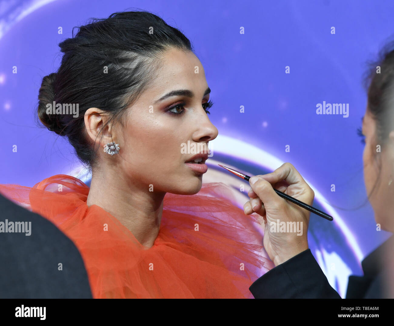 Berlin, Germany. 11th May, 2019. Actress Naomi Scott is painted on the carpet during the gala screening of the film 'Aladdin' at the cinema UCI Luxe Mercedes Square. The film will be released in German cinemas on 23.05.2019. The new Disney film is a real film adaptation of the 1992 cartoon of the same name and is based on the story Aladdin and the magic lamp from the fairy tales of 1001 Nights. Credit: Jens Kalaene/dpa-Zentralbild/dpa/Alamy Live News Stock Photo