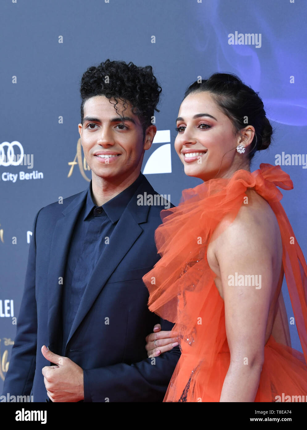 Berlin, Germany. 11th May, 2019. The actors Mena Massoud (l) and Naomi Scott at the gala screening of the film 'Aladdin' at the cinema UCI Luxe Mercedes Square. The film will be released in German cinemas on 23.05.2019. The new Disney film is a real film adaptation of the 1992 cartoon of the same name and is based on the story Aladdin and the magic lamp from the fairy tales of 1001 Nights. Credit: Jens Kalaene/dpa-Zentralbild/dpa/Alamy Live News Stock Photo