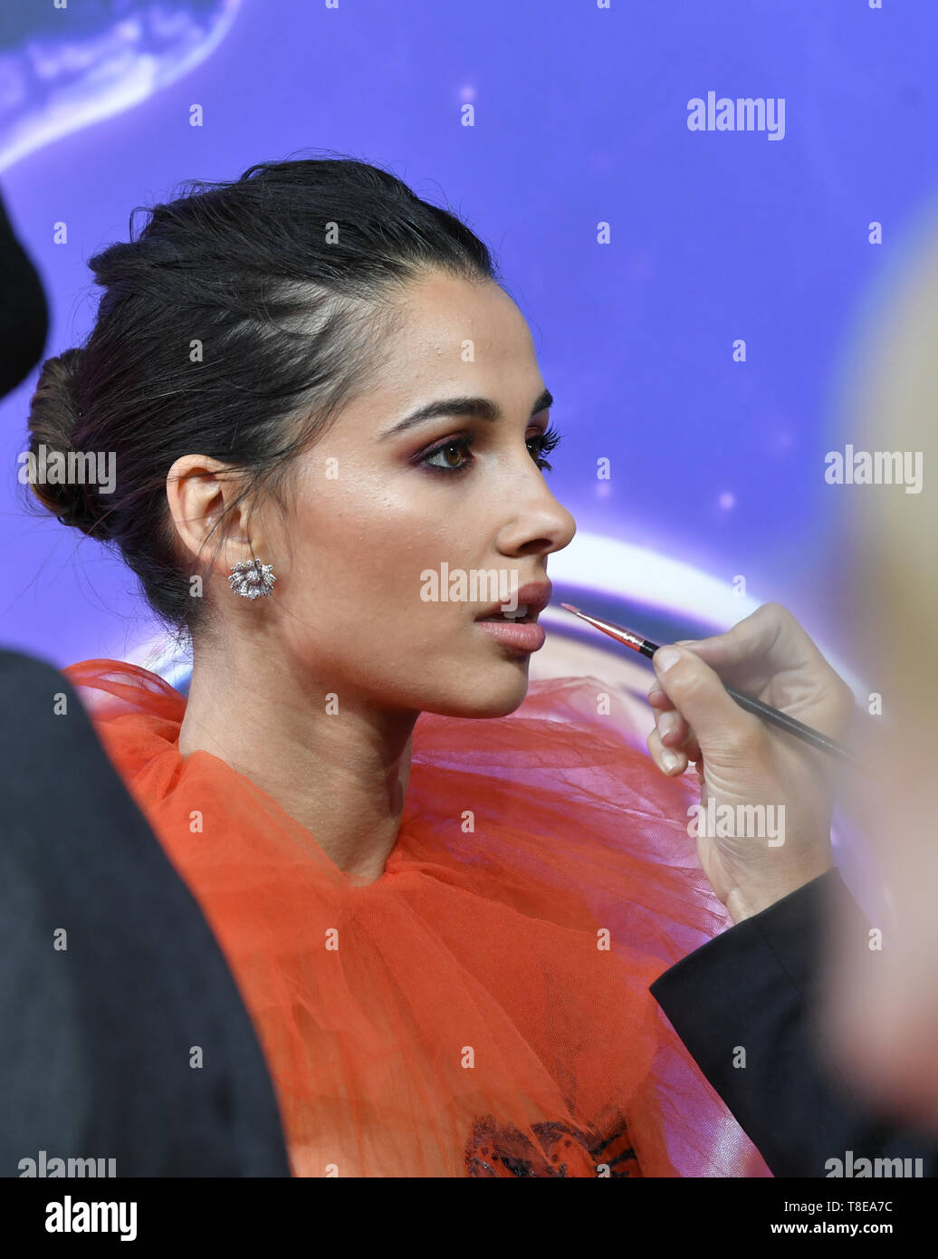 Berlin, Germany. 11th May, 2019. Actress Naomi Scott is painted on the carpet during the gala screening of the film 'Aladdin' at the cinema UCI Luxe Mercedes Square. The film will be released in German cinemas on 23.05.2019. The new Disney film is a real film adaptation of the 1992 cartoon of the same name and is based on the story Aladdin and the magic lamp from the fairy tales of 1001 Nights. Credit: Jens Kalaene/dpa-Zentralbild/dpa/Alamy Live News Stock Photo