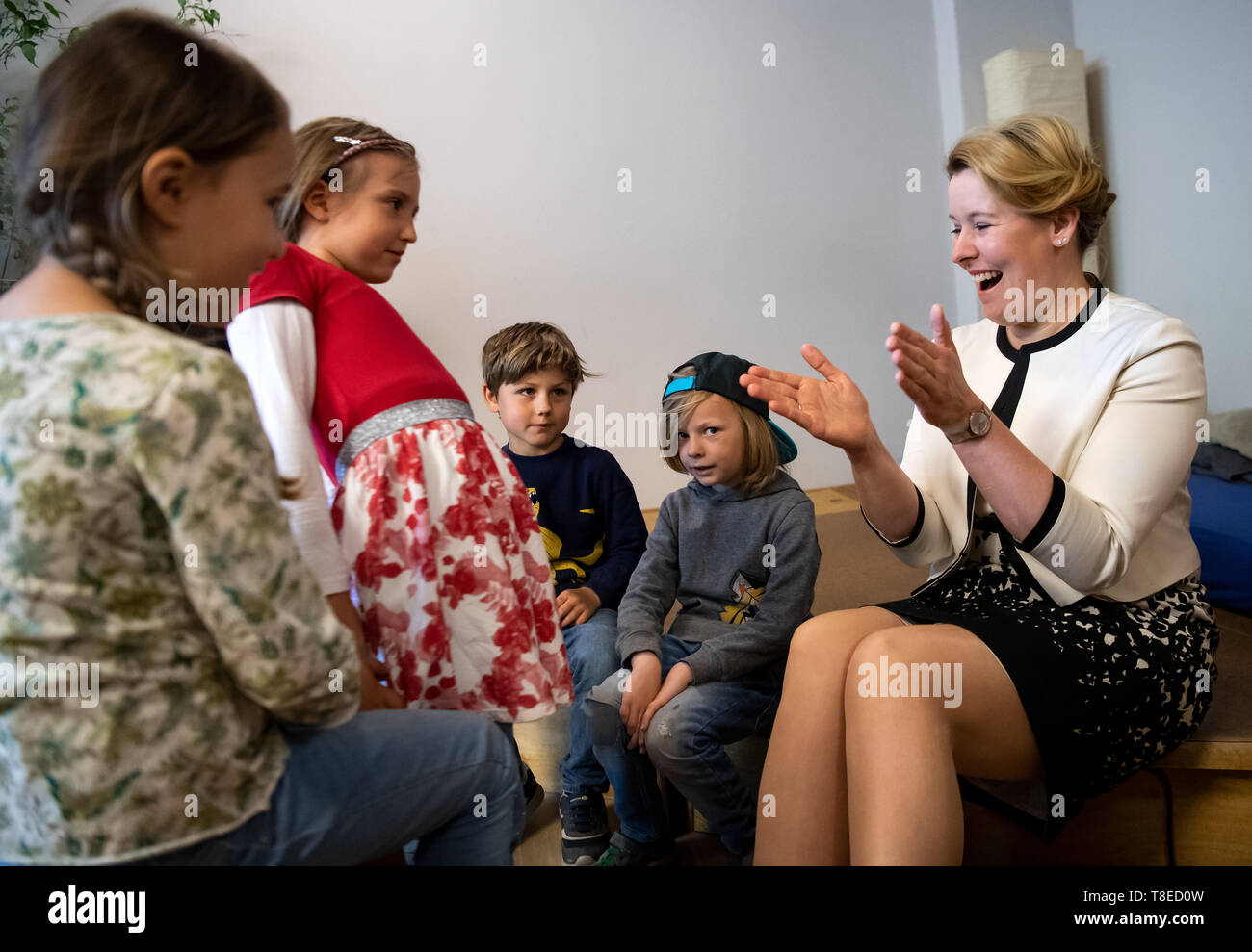 13 May 2019, Berlin: Franziska Giffey (SPD), Federal Minister for Family Affairs, visits the kindergarten 'Menschenskinder' in Berlin-Friedrichshain and lets children show her the rooms. Last year, the kindergarten was awarded the 'Kita of the Year' category by the Federal Ministry for Family Affairs, Senior Citizens, Women and Youth and the German Children and Youth Foundation (DKJS). This year's winners of the competition will be announced in the evening. Photo: Bernd von Jutrczenka/dpa Stock Photo