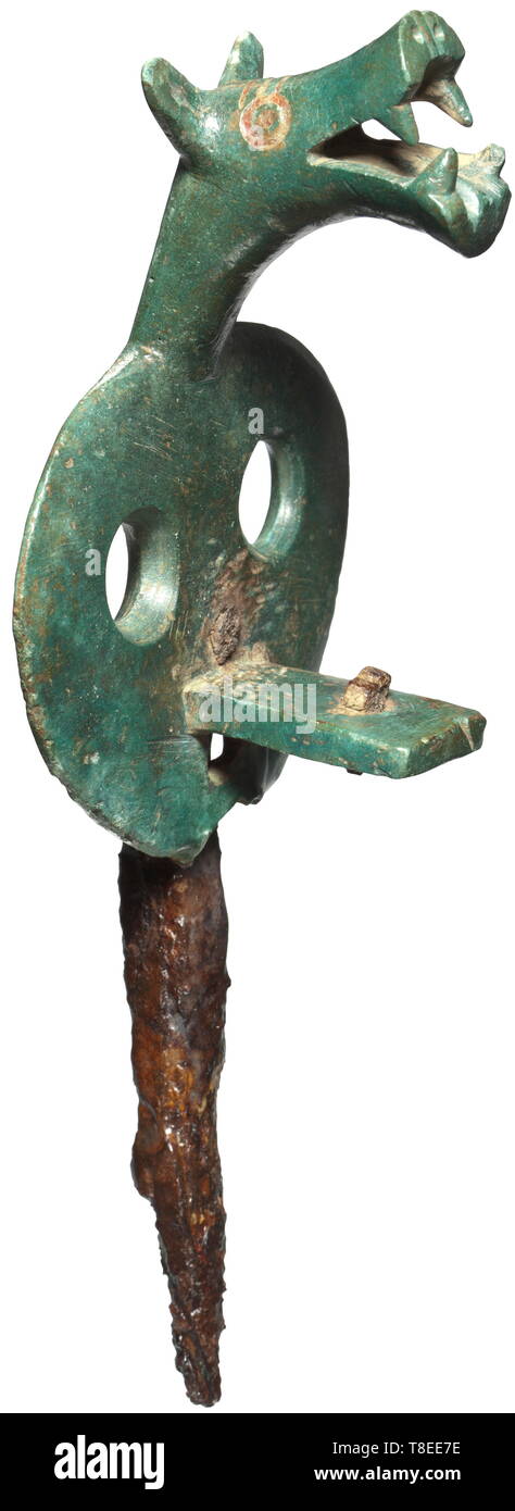 A Celtic linchpin of a war chariot, 3rd/2nd century BC Bronze/iron with emerald green patina. Tapered iron linchpin with two-fold openwork, riveted bronze disc and angle piece on the front side. The three-dimensionally modelled, stylised animal's head with red enamelled inlays in the eyes and on the forehead. Height 18.7 cm. Provenance: Hemmerich Collection, Vienna, 1950s until 1989. historic, historical, ancient world, Additional-Rights-Clearance-Info-Not-Available Stock Photo
