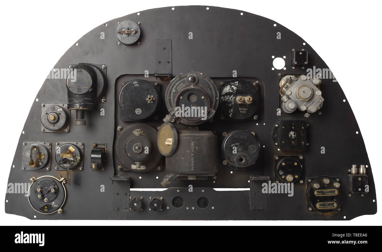 An instrument panel from the fighter plane Supermarine 'Spitfire - Mk II' A true to original replica of the dashboard using ORIGINAL instruments and switches (approximately 22 pieces) from the legendary English fighter plane. With it a reflecting gunsight 'Reflector Typ.I Mk. III.' with the serial no. '3841/44' and no. 'Stores Ref No. 8B/2519', with several plates, wiring and plugs. Furthermore the following instruments, among others, were used: manifold pressure indicator, airspeed indicator, turn and slip indicator, tachometer and altimeter, oil temperature, magnetic cont, Editorial-Use-Only Stock Photo