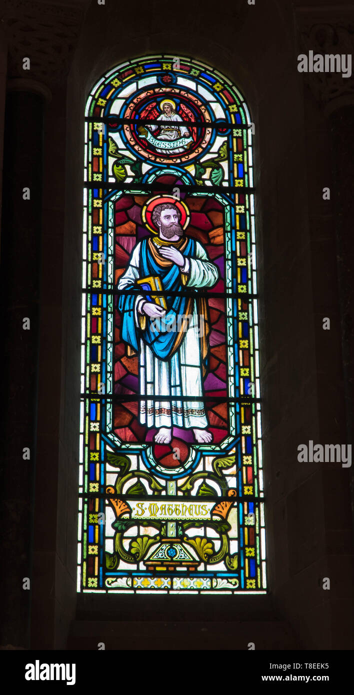 St. Matthew depicted in stained glass at St Catherine church, Hoarwithy Herefordshire England UK. February 2019. Stock Photo