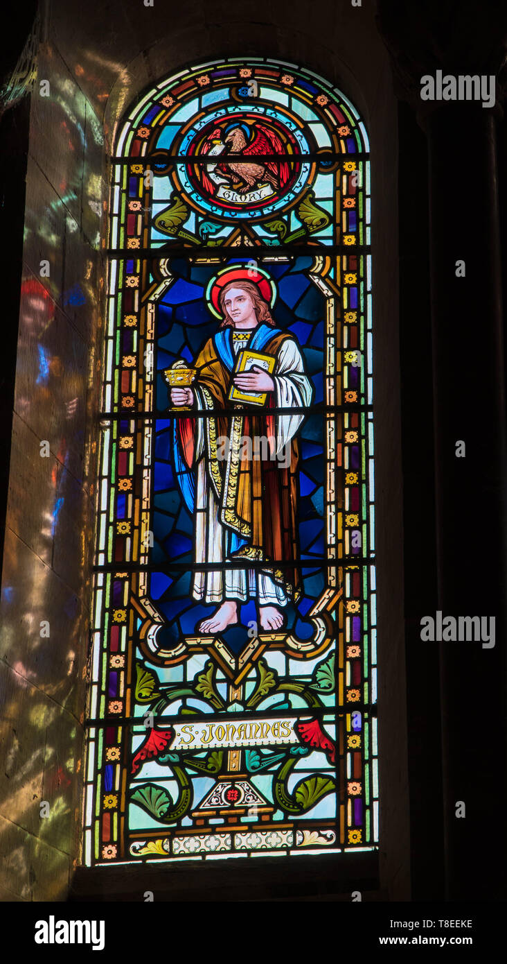 St. John depicted in stained glass at St Catherine church, Hoarwithy Herefordshire England UK. February 2019. Stock Photo