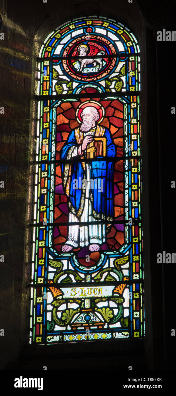 St. Luke depicted in stained glass at St Catherine church, Hoarwithy Herefordshire England UK. February 2019. Stock Photo