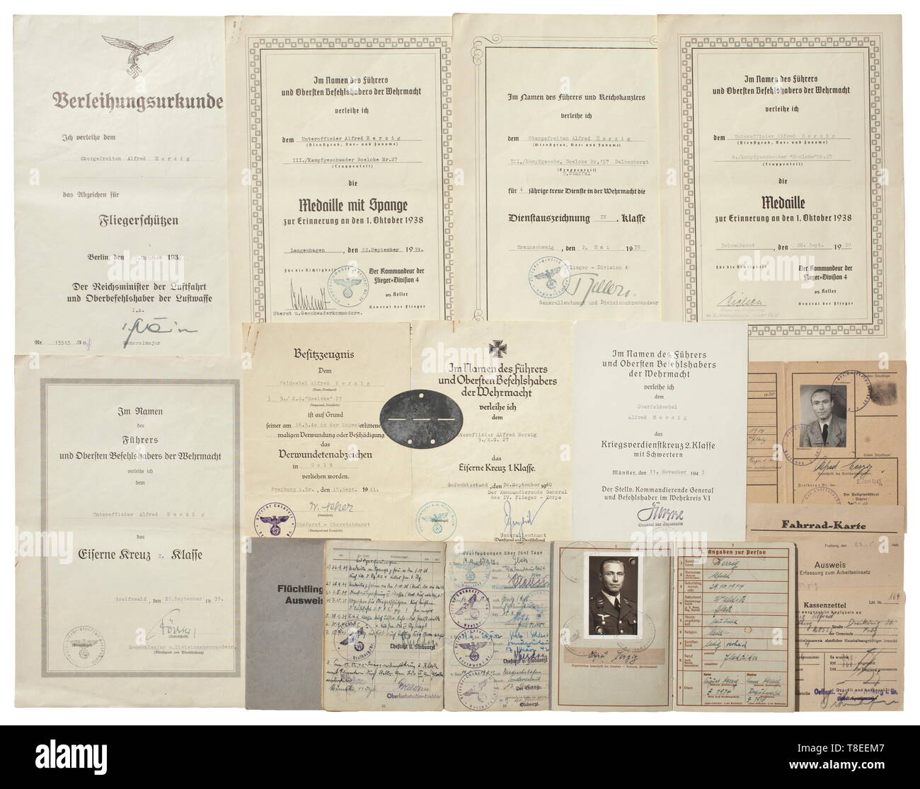 A group of award documents and documentation - Oberfeldwebel Alfred Herzig in Bomber Wing Boelcke no. 27 The pay book from 1 March 1939 to the final entry on 5 December 1944. Also the Wehrpass (military service book) with award entries and identity disc. Further, eight award documents (War Merit Cross with Swords, Iron Cross 1st and 2nd Class, Air Gunner's Badge etc.). Together with Herzig's postwar documents and identity cards. Signs of age. historic, historical, Air Force, branch of service, branches of service, armed service, armed services, military, militaria, air forc, Editorial-Use-Only Stock Photo