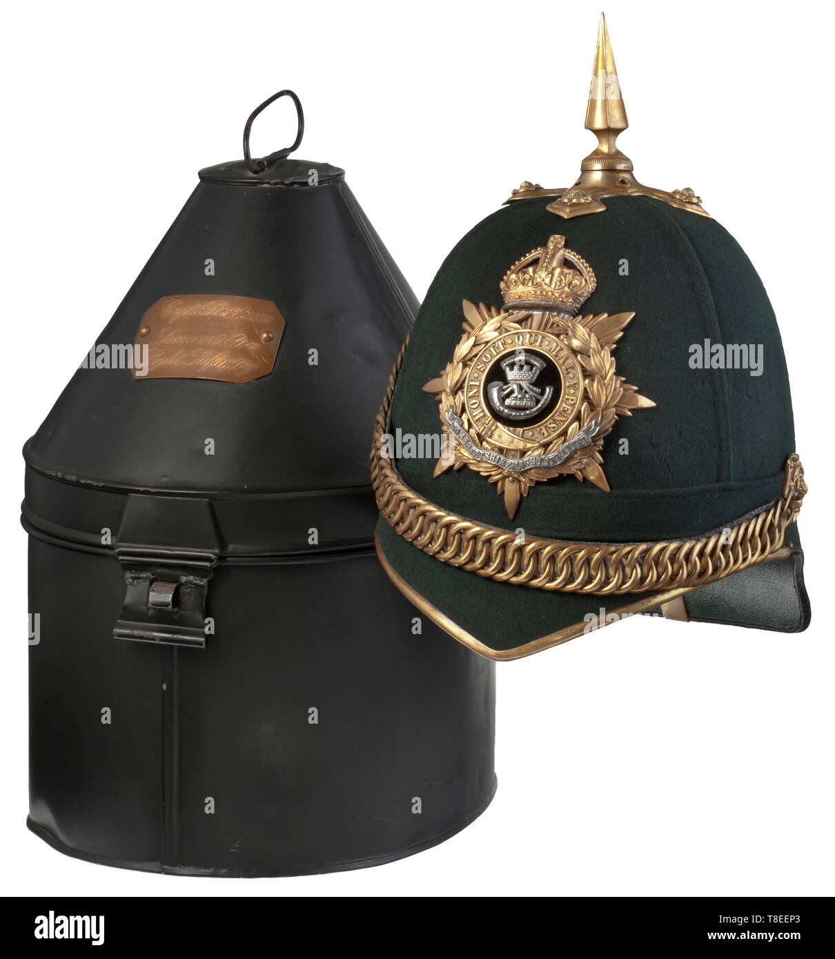 A helmet for officers of the Somersetshire Light Infantry, 1st half of the 20th century The helmet skull covered with black-green felt, non-ferrous metal fittings (gilt vestiges), the cross plate with relief-worked roses, screwed-on tip, the emblem with regimental insignia beneath a royal crown. Velvet underlaid chain on relief-worked rosettes. Light cotton liner with maker´s stamp 'Hawkes, London', old wearer- and size label '6 7/8 full', light leather sweatband, crimson silk (damaged). In an unusually well-preserved helmet box with wearer´s pla, Additional-Rights-Clearance-Info-Not-Available Stock Photo