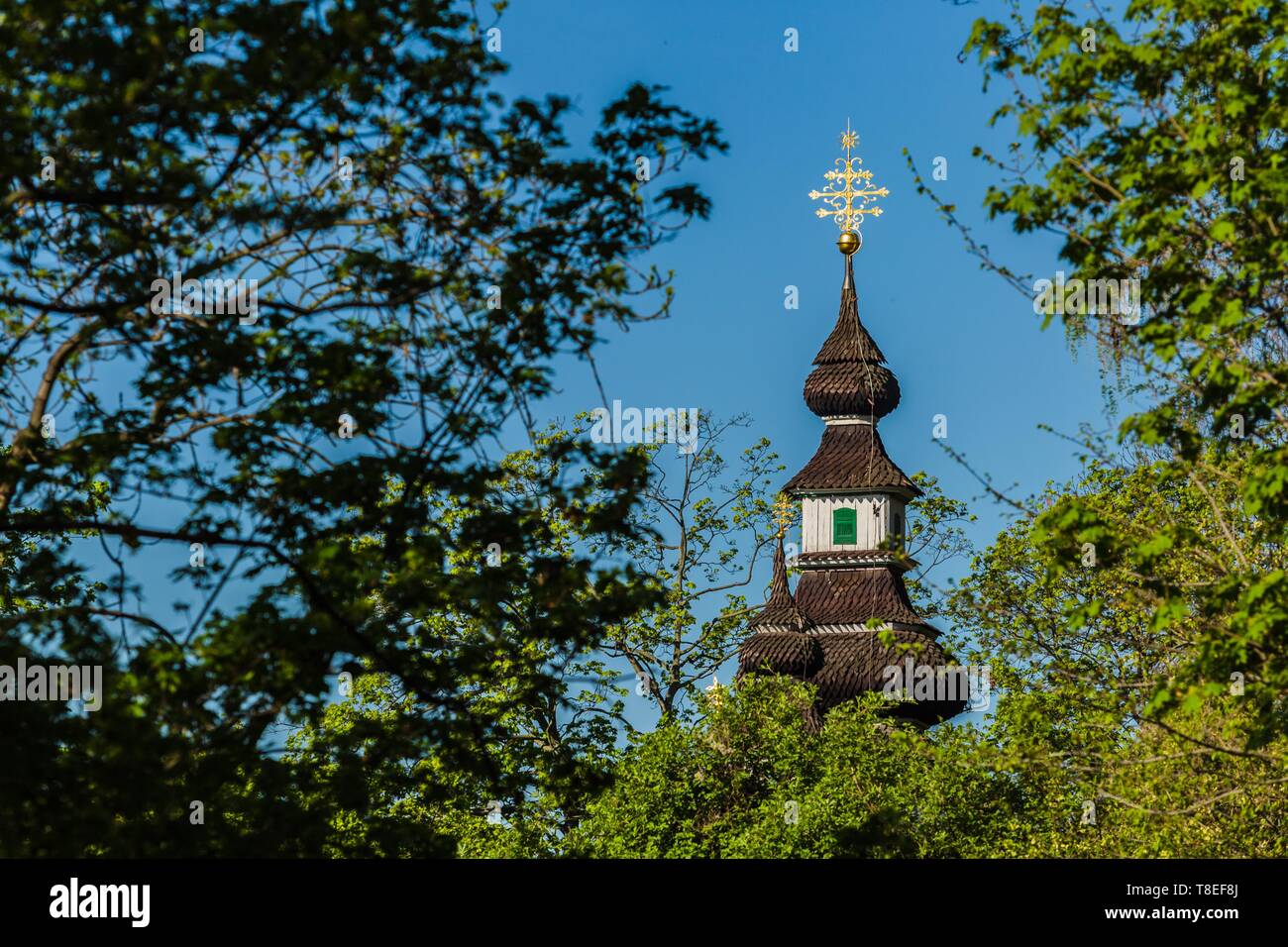 Prague, Czech Republic / Europe - April 22 2019: Spire of the church of the Archangel Michael built in 18th century. It has shingled roof. Stock Photo