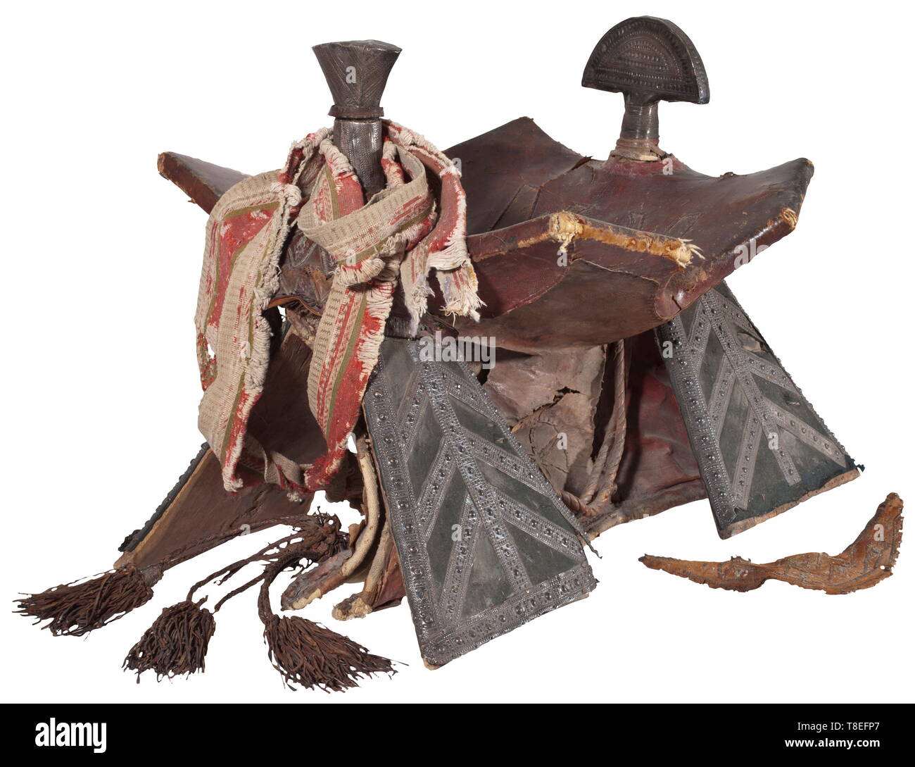 A Sudanese camel saddle, 19th century Wooden framework covered with textile and leather respectively studded with richly punched sheet silver. The seating surface covered with variously coloured leather. Surcingle made from braided leather and textile. Distinct traces of use and age. Length 64 cm, height 52 cm. historic, historical, Africa, African, weapon, arms, weapons, arms, fighting device, 19th century, Additional-Rights-Clearance-Info-Not-Available Stock Photo