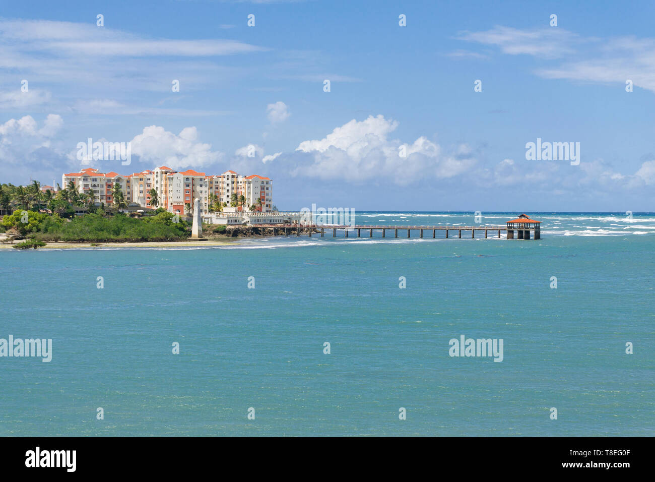 View towards the Indian ocean with large jetty and apartment buildings on the horizon, Mombasa, Kenya Stock Photo