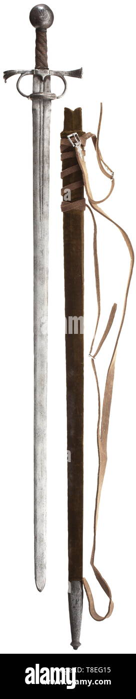 An arming sword, Italian or Spanish circa 1530-50. With heavy double-edged blade of flattened hexagonal section coming to a short point (associated), formed with a ricasso and cut with a group of small marks capping a pair of narrow fullers on both sides at the forte, iron proto-rapier hilt formed of a pair of quillons with horizontally recurved fishtail terminals cut with a prominent ridge over their respective outer sides, a pair of faceted arms carrying at their head an inverted U-shaped bar ridged en suite with the quillon terminals (broken a, Additional-Rights-Clearance-Info-Not-Available Stock Photo