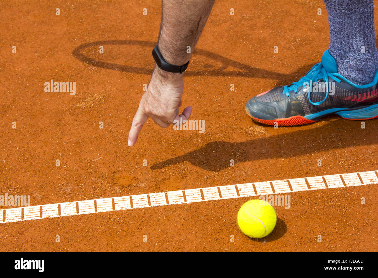 Tennis player shows the track on the tennis court Stock Photo