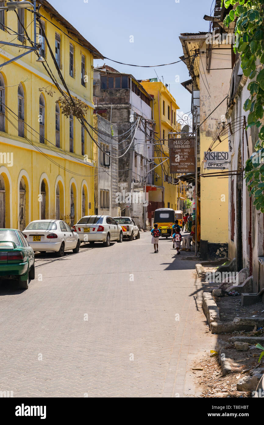 Typical view of buildings on a side street in the old town area of Mombasa, Kenya Stock Photo