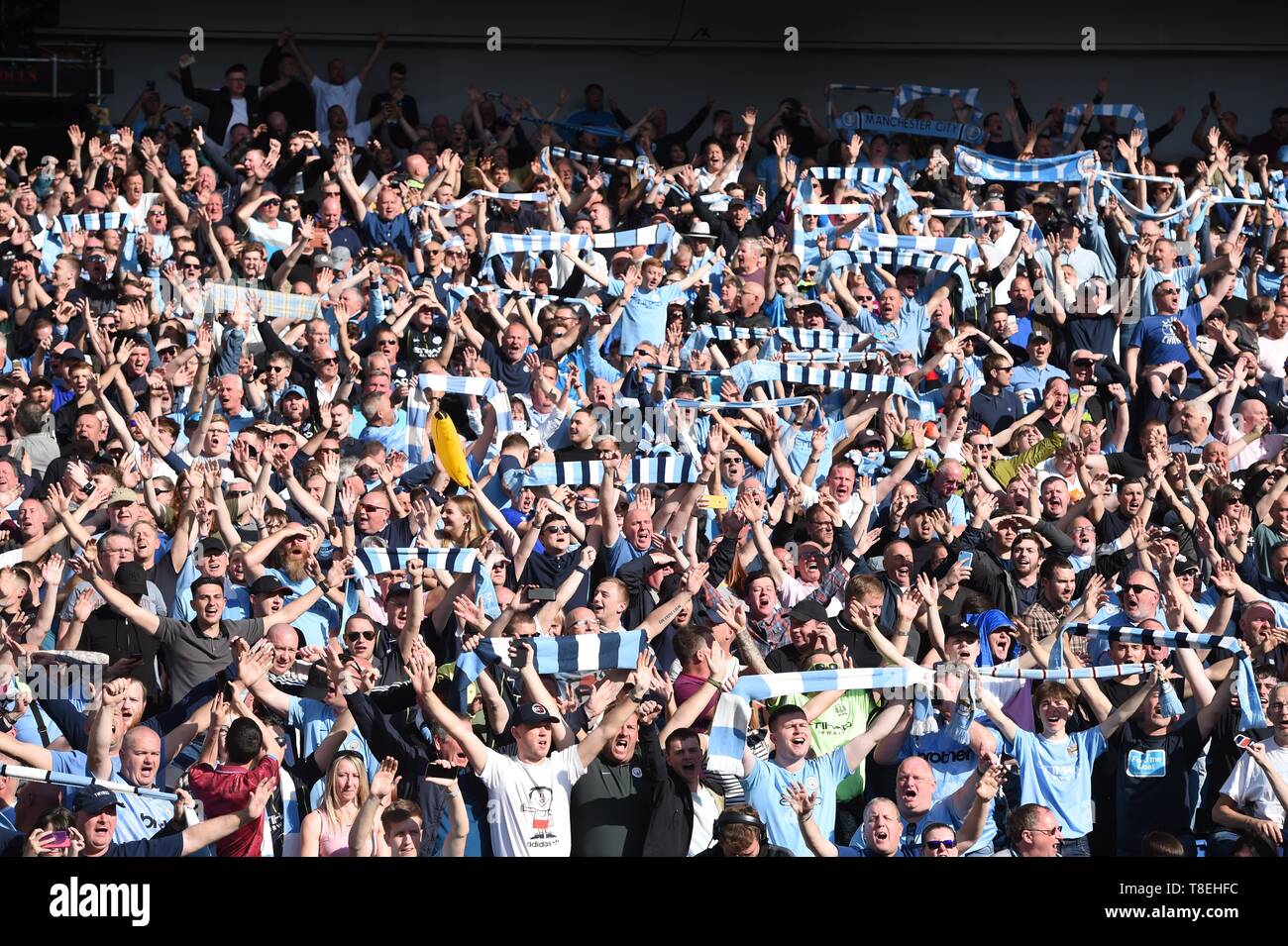 City fans celebrate winning the title during the Premier League match between Brighton & Hove Albion and Manchester City  at the American Express Community Stadium 12 May 2019 Photo Simon Dack/Telephoto Images Editorial use only. No merchandising. For Football images FA and Premier League restrictions apply inc. no internet/mobile usage without FAPL license - for details contact Football Dataco Stock Photo