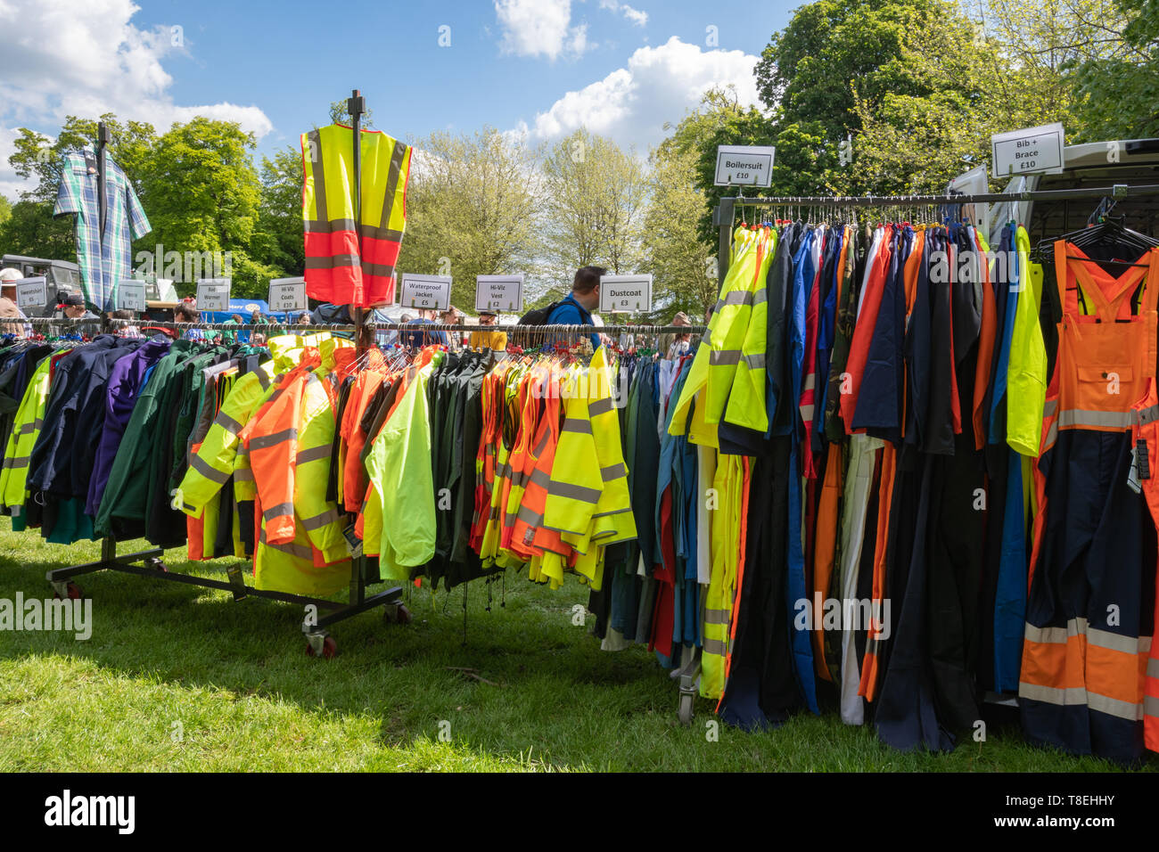 High-vis (high visibility, high viz) jackets and other clothing on sale at a show, UK. Brightly coloured reflective personal protective equipment. Stock Photo