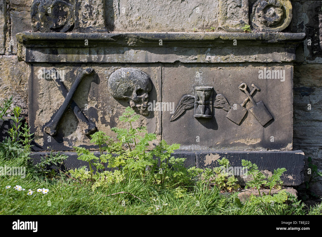 Weathered memorial with various symbols in Old Calton Burial Ground, Edinburgh, Scotland, UK Stock Photo