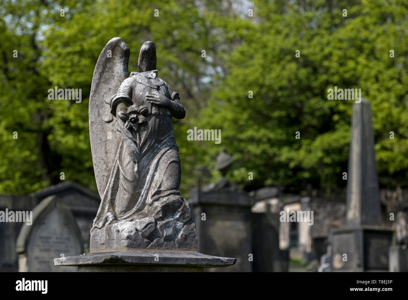 Damaged figure of an angel in New Calton Burial Ground, Edinburgh, Scotland, UK. Stock Photo