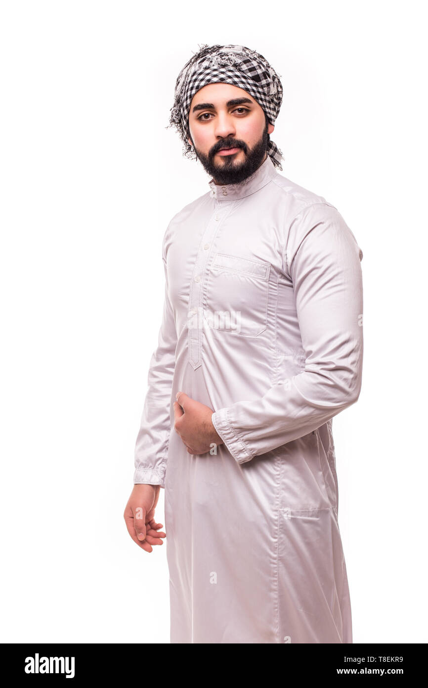 Young arab handsome man wearing in traditional abaya clothes isolated on  white background Stock Photo - Alamy