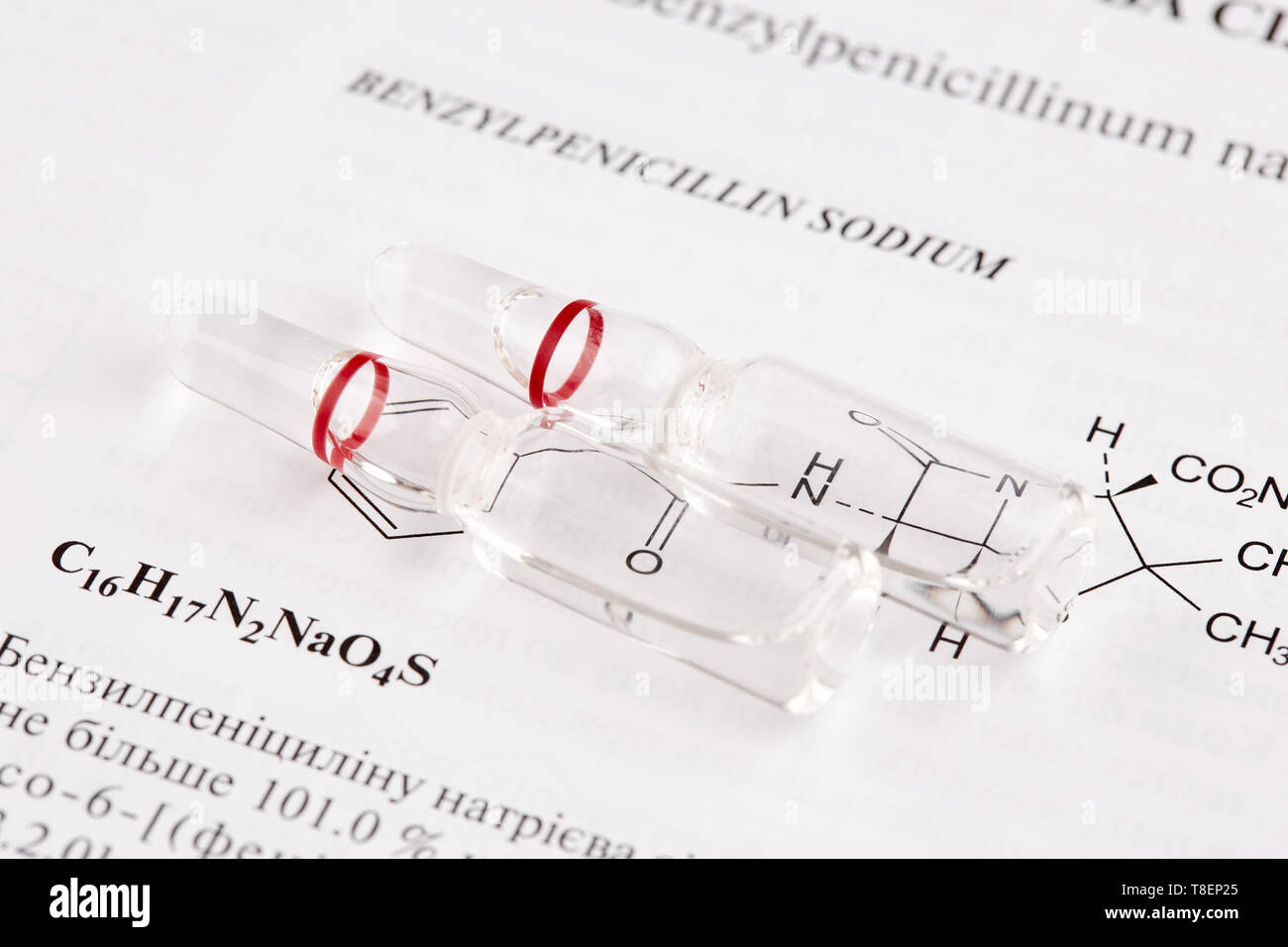 Two ampoules on book page with chemical formula Stock Photo Alamy
