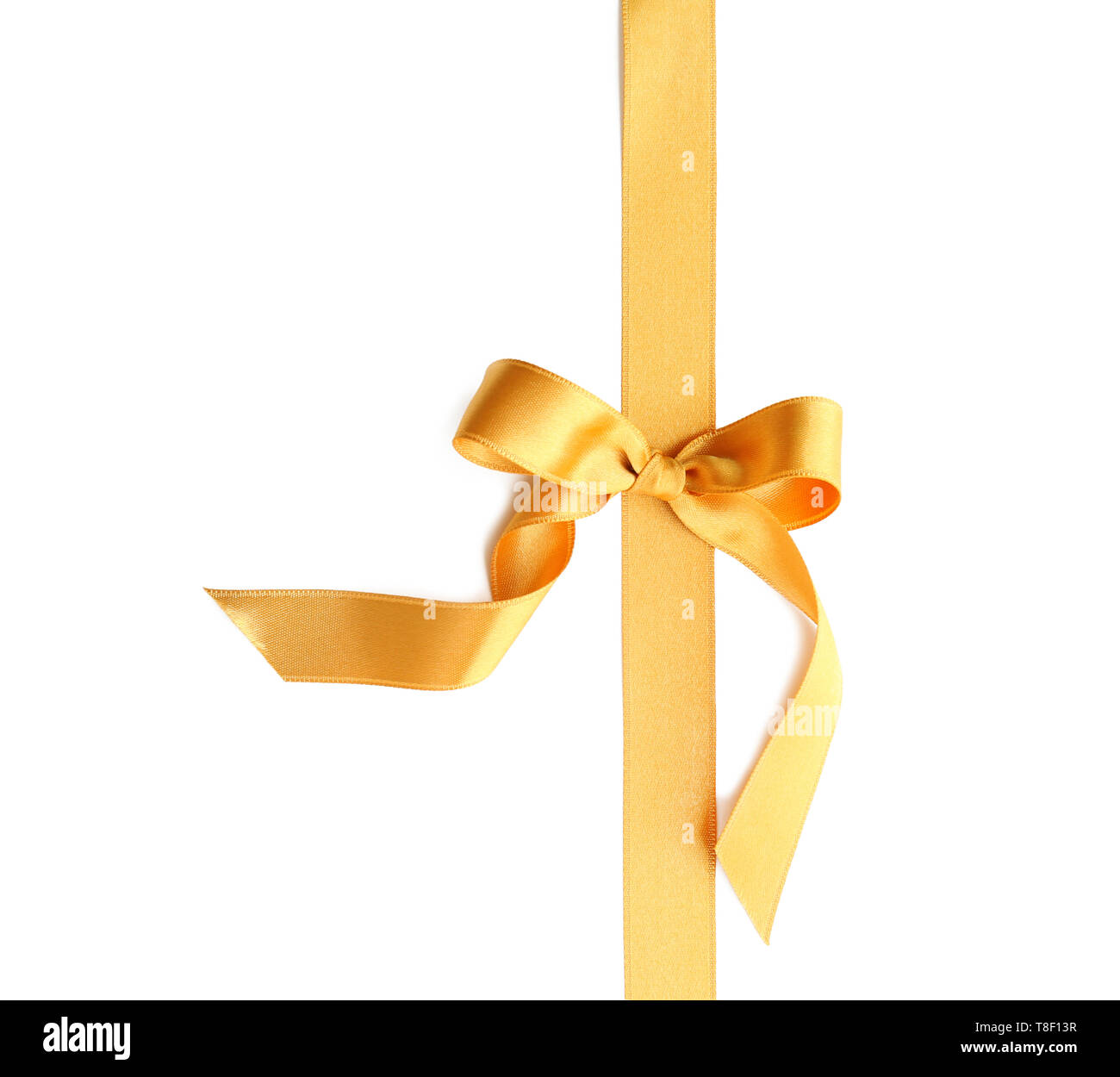 Golden ribbon with bow on white background Stock Photo - Alamy