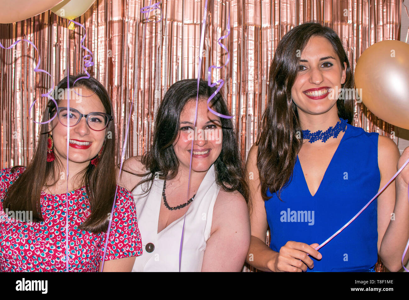 Murcia, Spain May 12, 2019: Birthday friends parties. Attractive women celebrate special dates. Familiar gathering. Happy woman smile with balloons at a party. Stock Photo