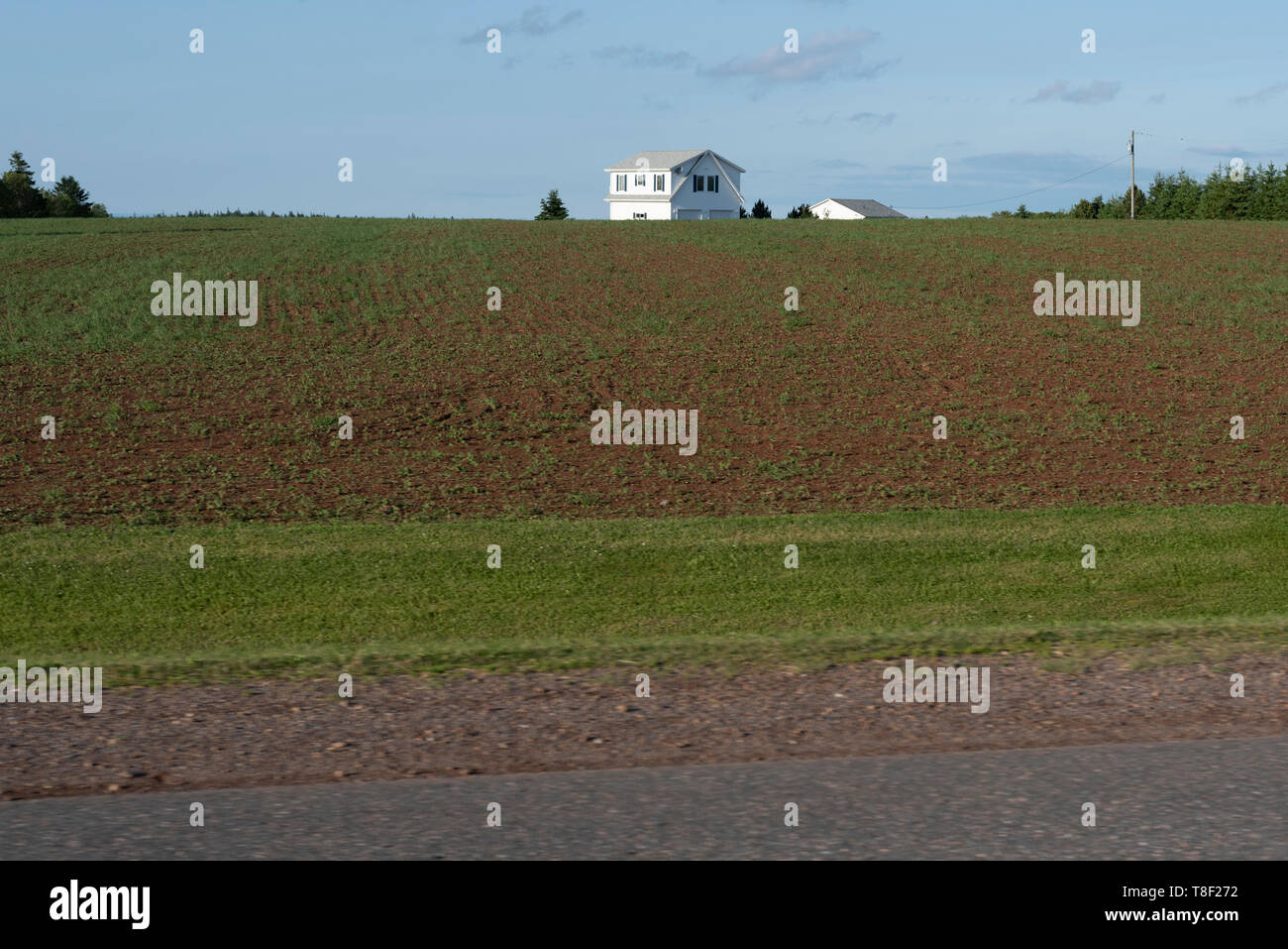 Rolling hills, agriculture & farm lands along provincial roadway of