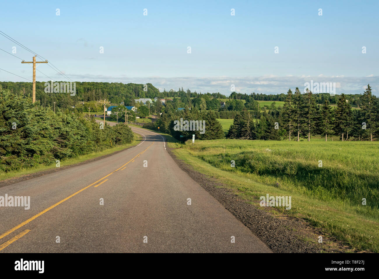 Rolling hills, agriculture & farm lands along provincial roadway of