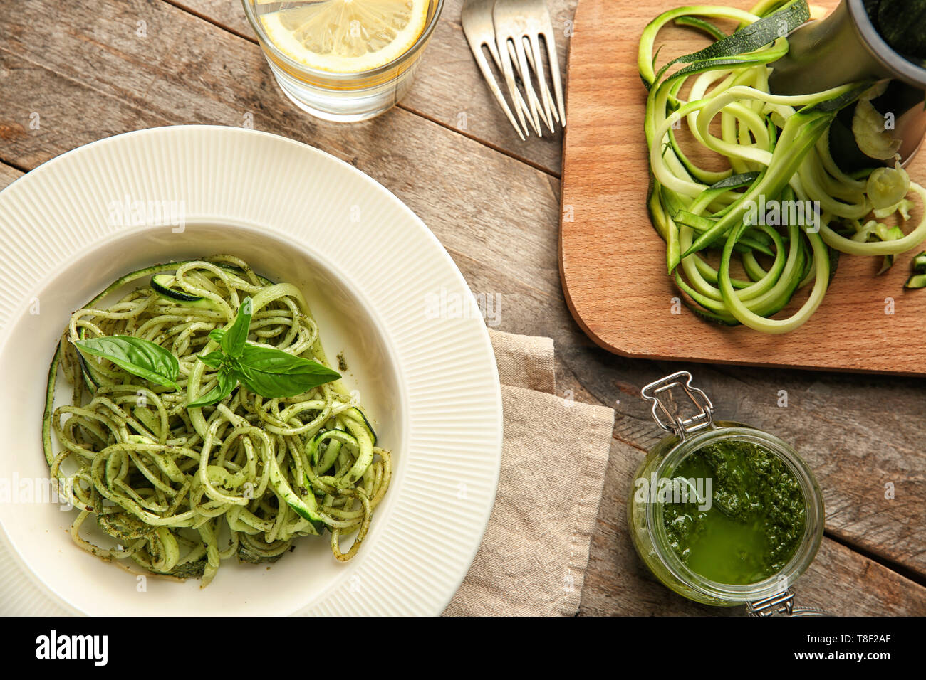 Plate Of Spaghetti With Zucchini And Pesto Sauce On Wooden Table Stock Photo Alamy