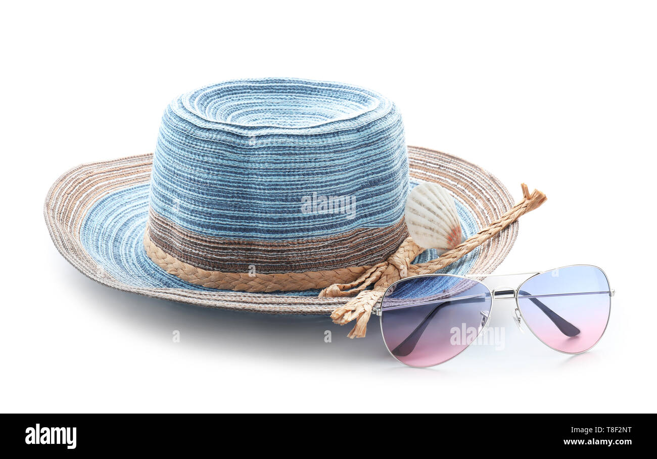Stylish hat and sunglasses on white background Stock Photo - Alamy