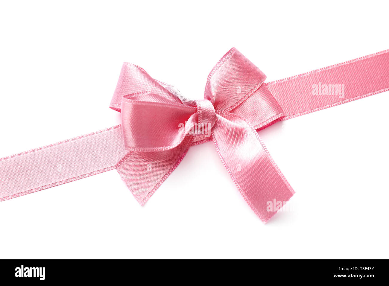 Pink satin ribbon with bow on white background Stock Photo - Alamy