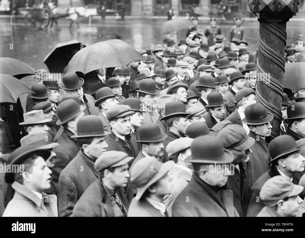 Lawrence strike meeting, New York - Photo shows group of men gathered outdoors, probably in New York City, to hear about the textile strike in Lawrence, Massachusetts, 1912 Stock Photo