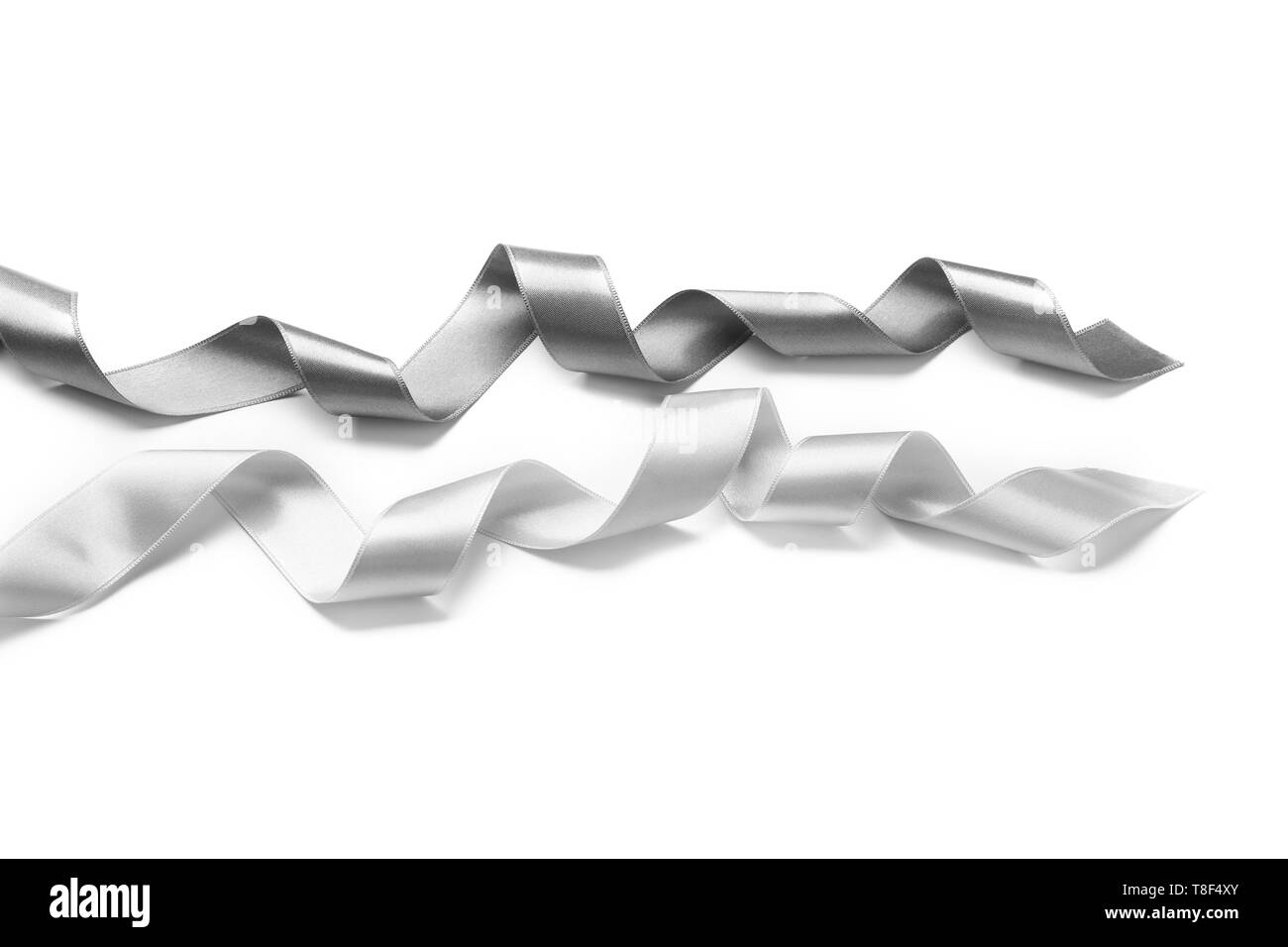 Silver ribbons on white background Stock Photo - Alamy