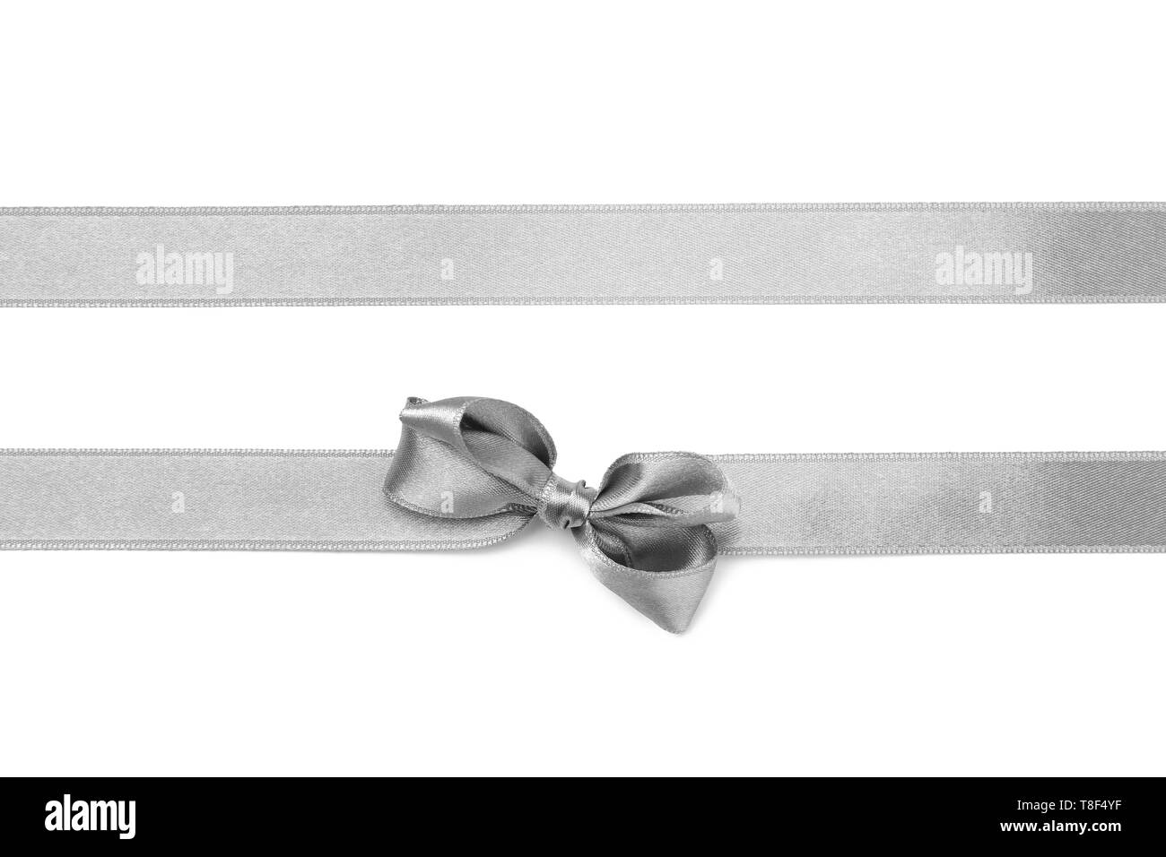 Silver ribbons with bow on white background Stock Photo - Alamy