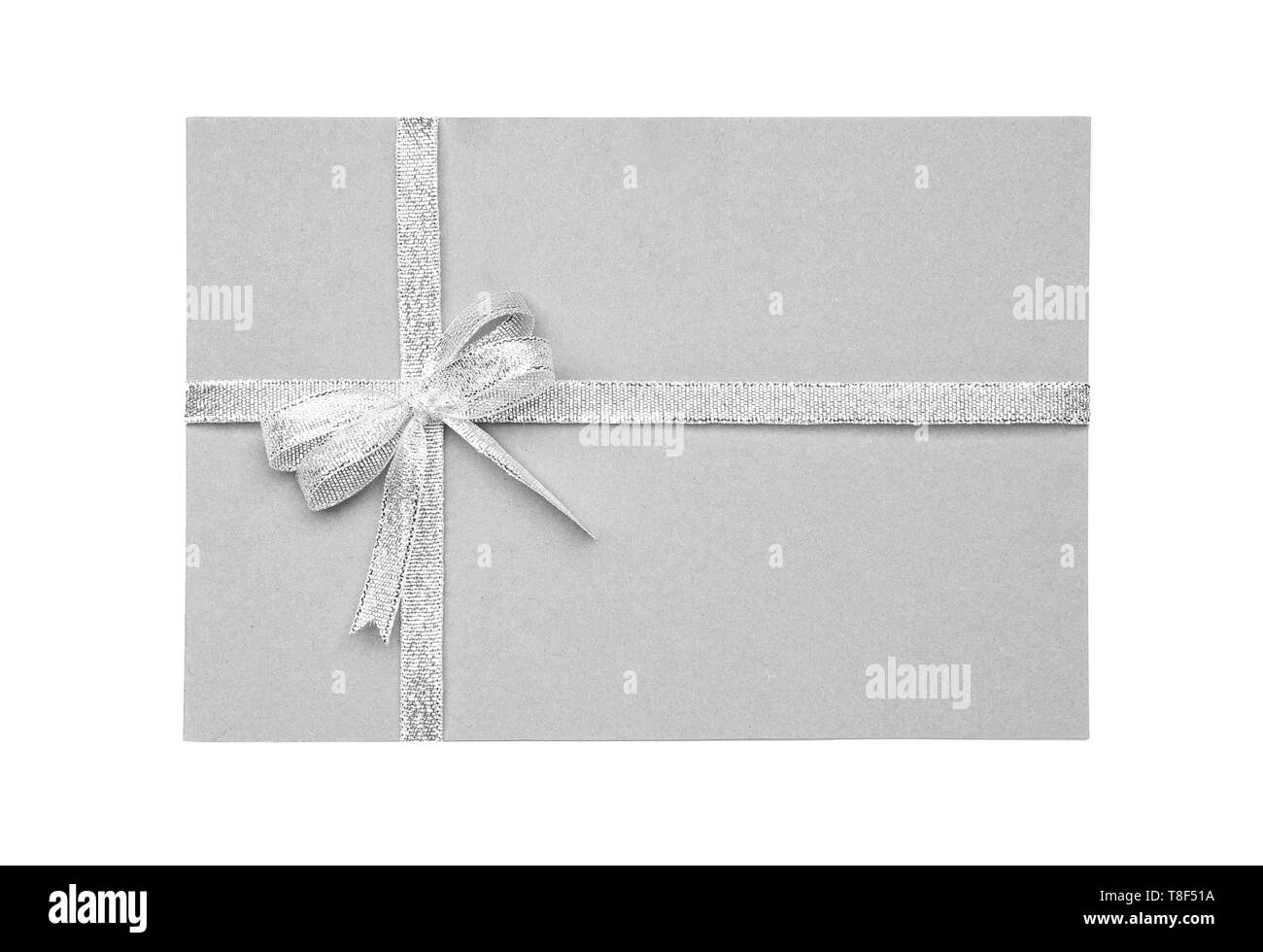 Blank paper card with silver ribbon and bow on white background Stock