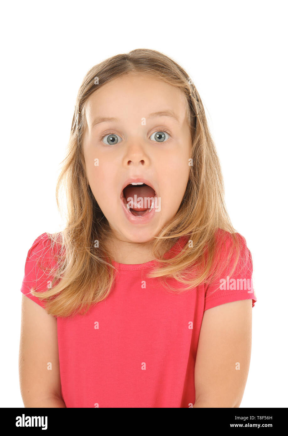 Surprised little girl on white background Stock Photo - Alamy