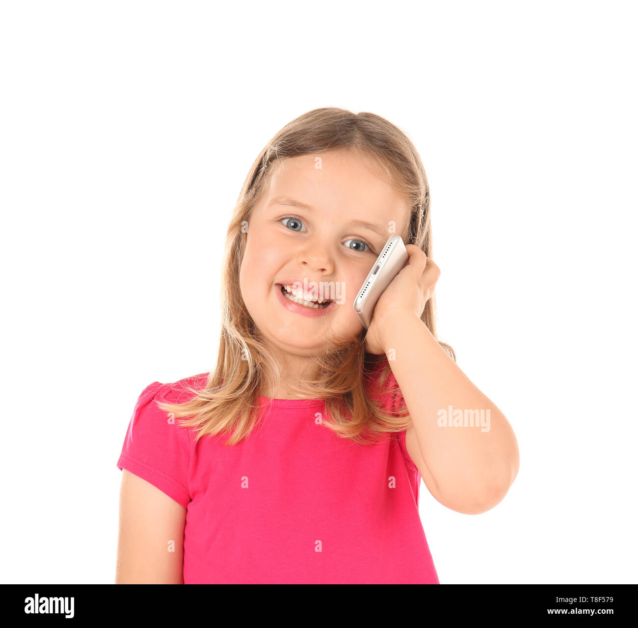Cute little girl talking on mobile phone against white background Stock ...