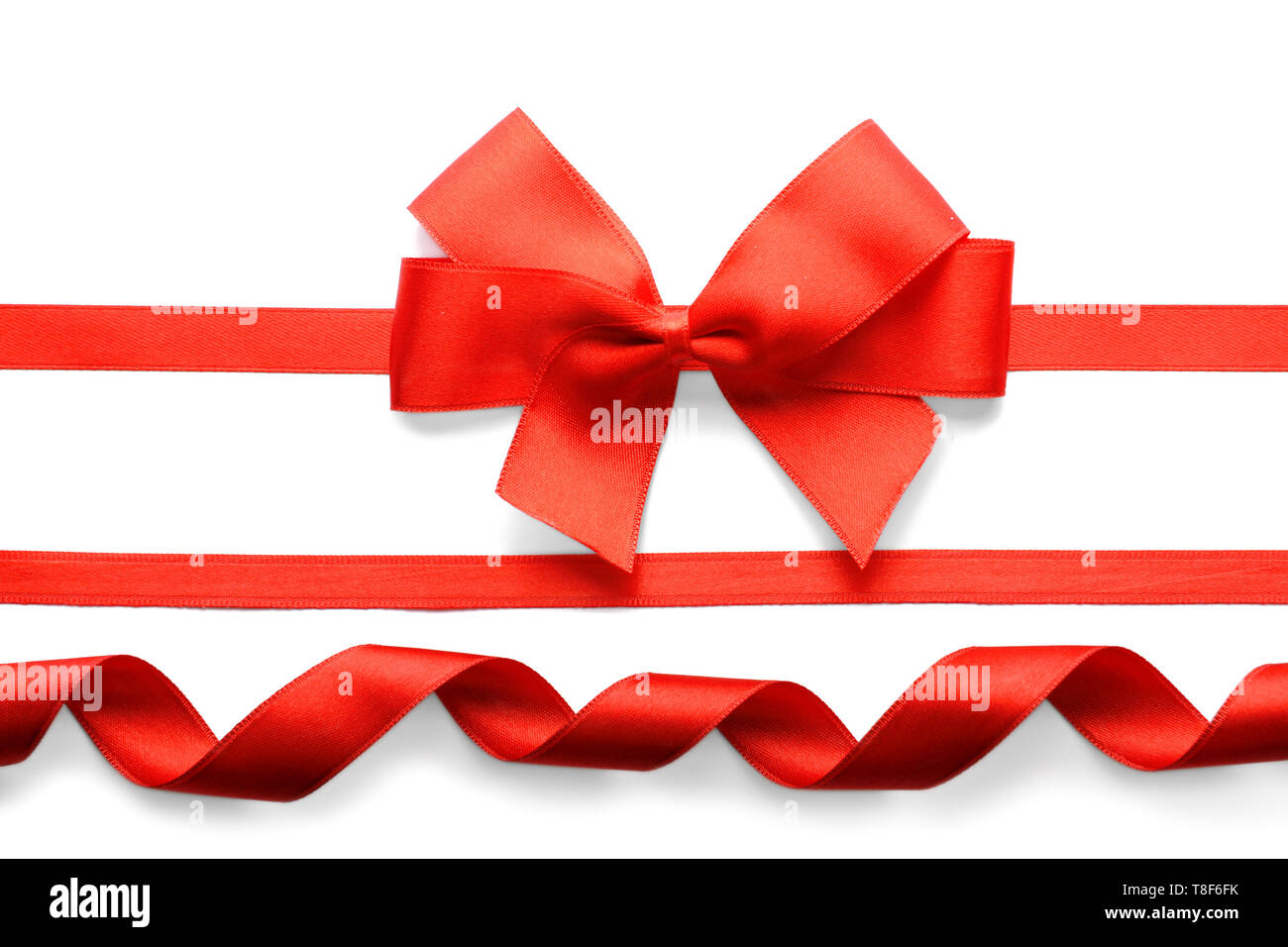 Red ribbons with beautiful bow on white background Stock Photo - Alamy
