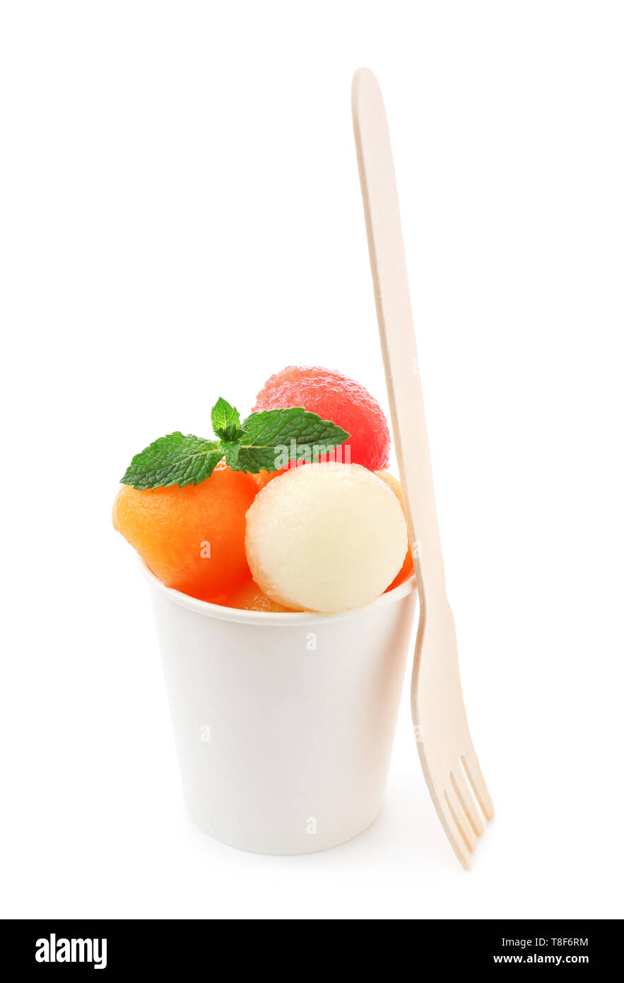 Cup with fresh melon and watermelon balls on white background Stock