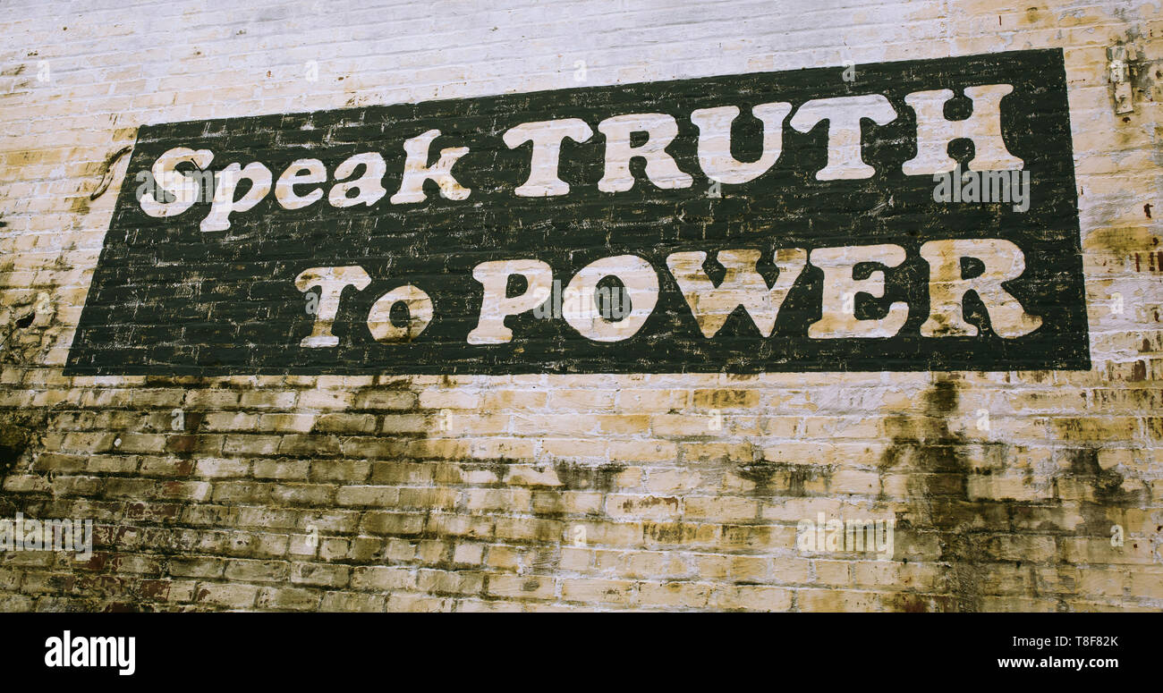 Painted sign on wall in Culpeper Virginia 'Speak Truth to Power' Stock Photo