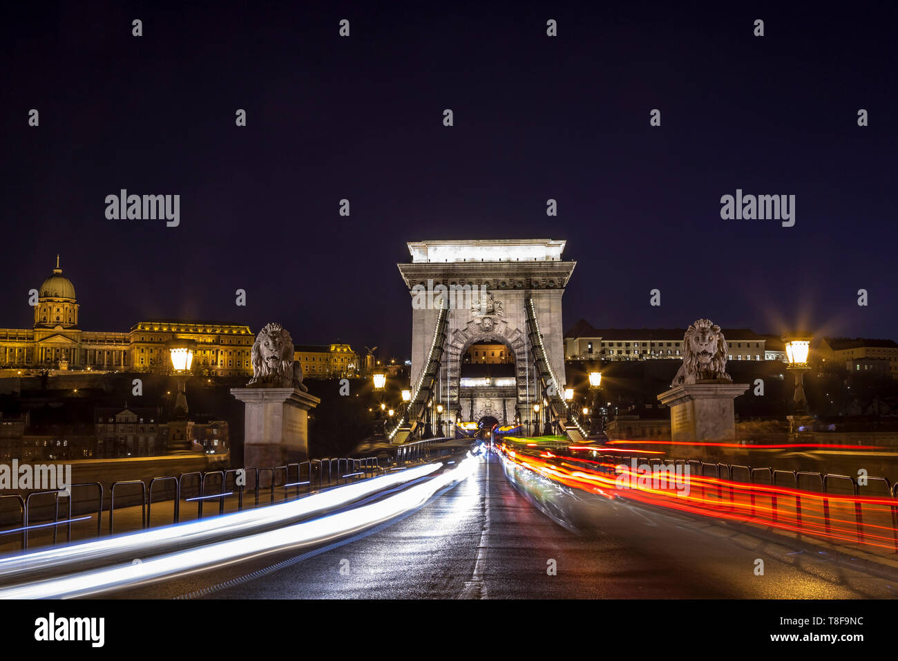 Traffic moving over Budapest's iconic Chain Bridge at twilight Stock Photo