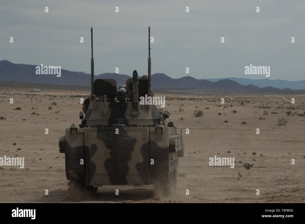 11th Armored Cavalry Troopers hold their position awaiting the advancing elements of the 2nd Armored Brigade Combat Team, 1st Cavalry Division, National Training Center, Calif., April 11th, 2019. This defense will test the 2/1 ABCT Cav’s ability to attack and hold a foreign city. (U.S. Army Photo By Pv2 James Newsome) Stock Photo