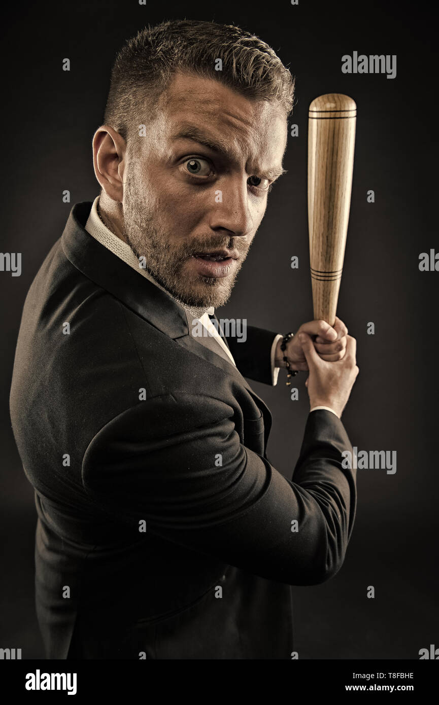 Businessman beat with baseball bat in hands. Bearded man with bat weapon.  Aggression concept. ambitions and violence concept. Business fashion and  style, vintage filter Stock Photo - Alamy