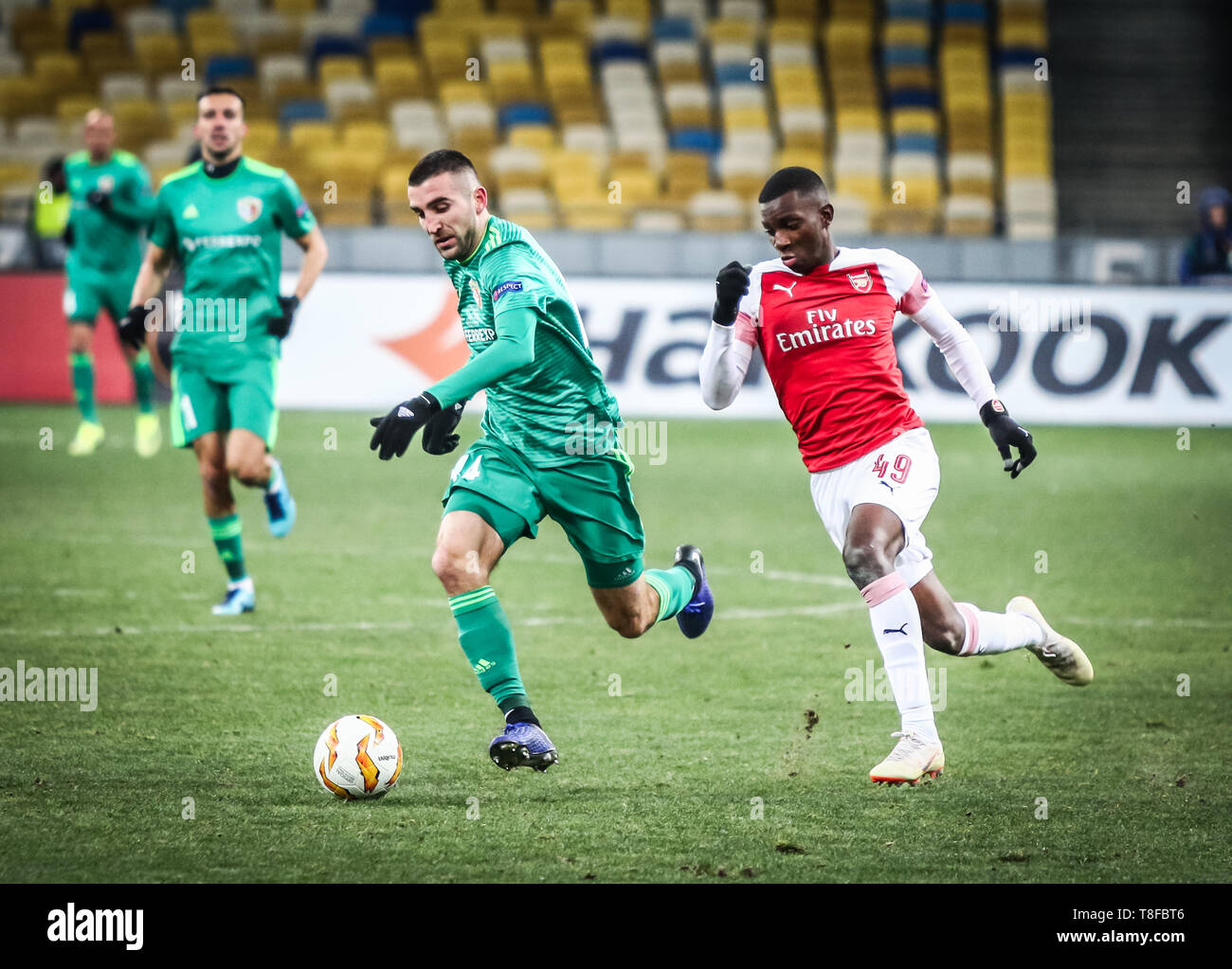 KYIV, UKRAINE - NOVEMBER 29, 2018: Ardin Dallku of Vorskla Poltava (L) fights for a ball with Eddie Nketiah of Arsenal during their UEFA Europa League Stock Photo