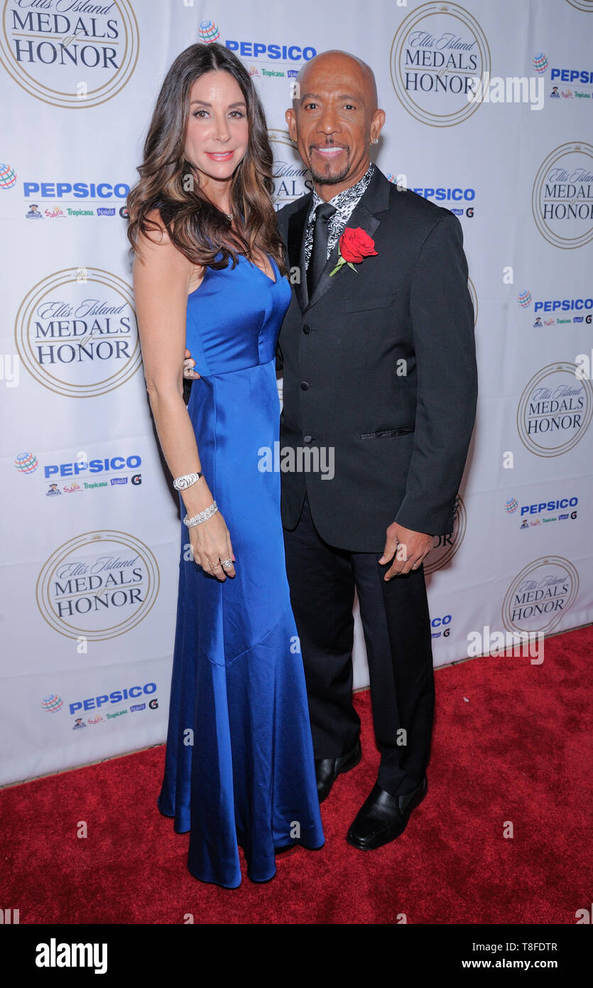 Ellis Island, NY - May 11, 2019:  Tara Flower and Montel Williams attend the 34th Annual Ellis Island Medals Of Honor Ceremony at Ellis Island Stock Photo