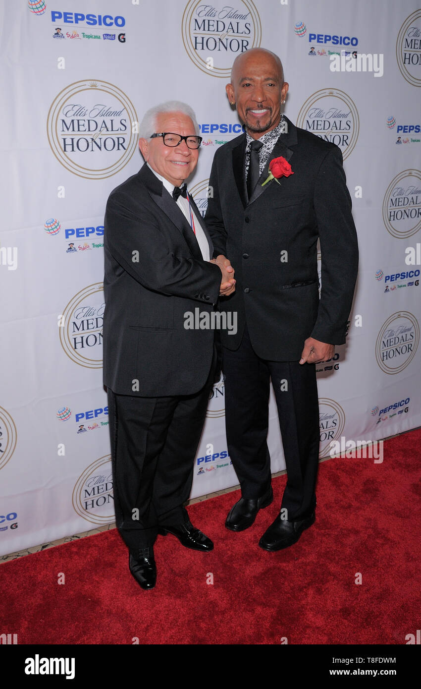 Ellis Island, NY - May 11, 2019: Nasser Kazeminy and Montel Williams attend the 34th Annual Ellis Island Medals Of Honor Ceremony at Ellis Island Stock Photo