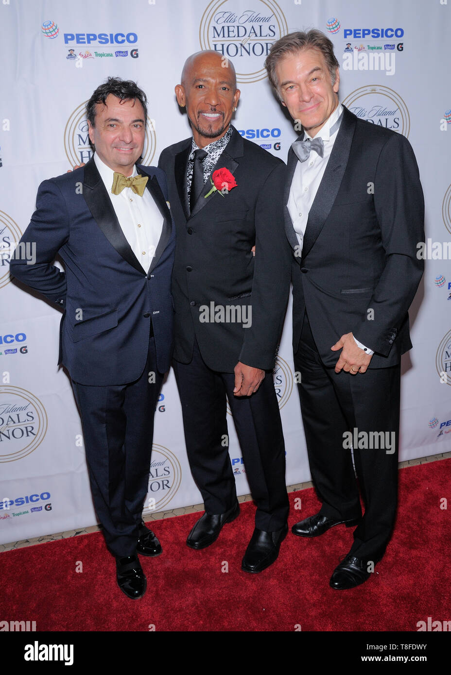 Ellis Island, NY - May 11, 2019: Guest, Montel Williams and Mehmet Oz attend the 34th Annual Ellis Island Medals Of Honor Ceremony at Ellis Island Stock Photo